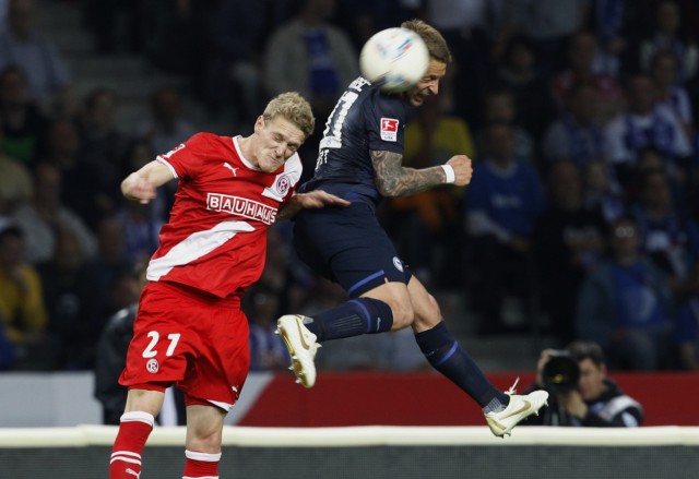 van den Bergh of Fortuna Duesseldorf fights for the ball with Ebert of Hertha Berlin during their Bundesliga first division relegation soccer match in Berlin
