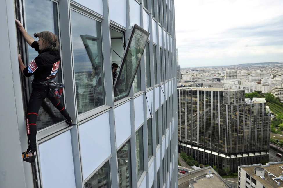 Alain Robert Climbs First Tower in Paris