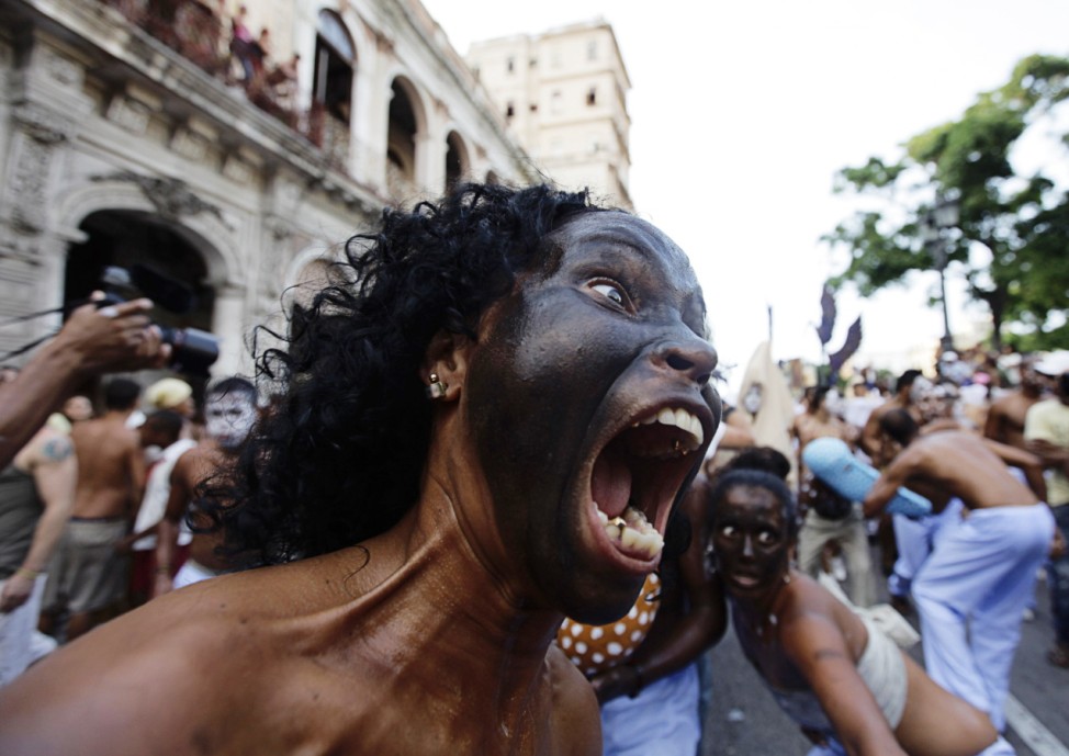 Actors perform during a project organized by Afro-Cuban artist Mendive ahead of the upcoming 11th Biennial contemporary art festival in Havana