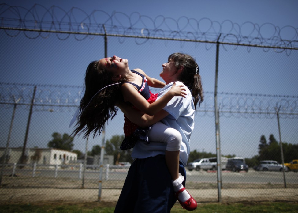 Cori Walters hugs her daughter Hannah Walters at California Institute for Women state prison in Chino