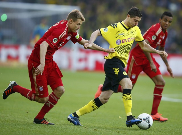 Bayern Munich's Badstuber challenges Borussia Dortmund's Lewandowski during German DFB Cup final soccer match in Berlin