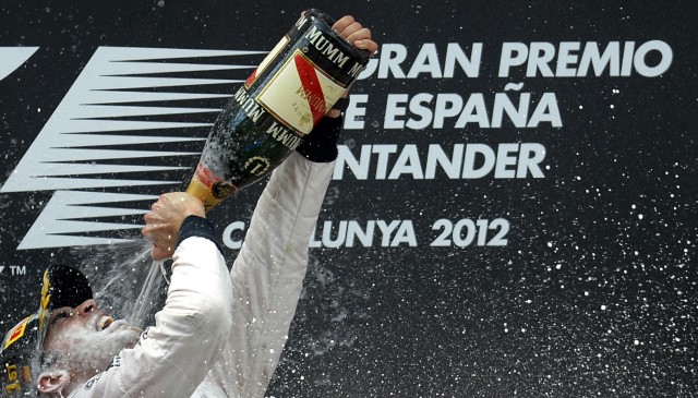 Williams Formula One driver Pastor Maldonado prays champagne as he celebrates winning the Spanish F1 Grand Prix in Montmelo