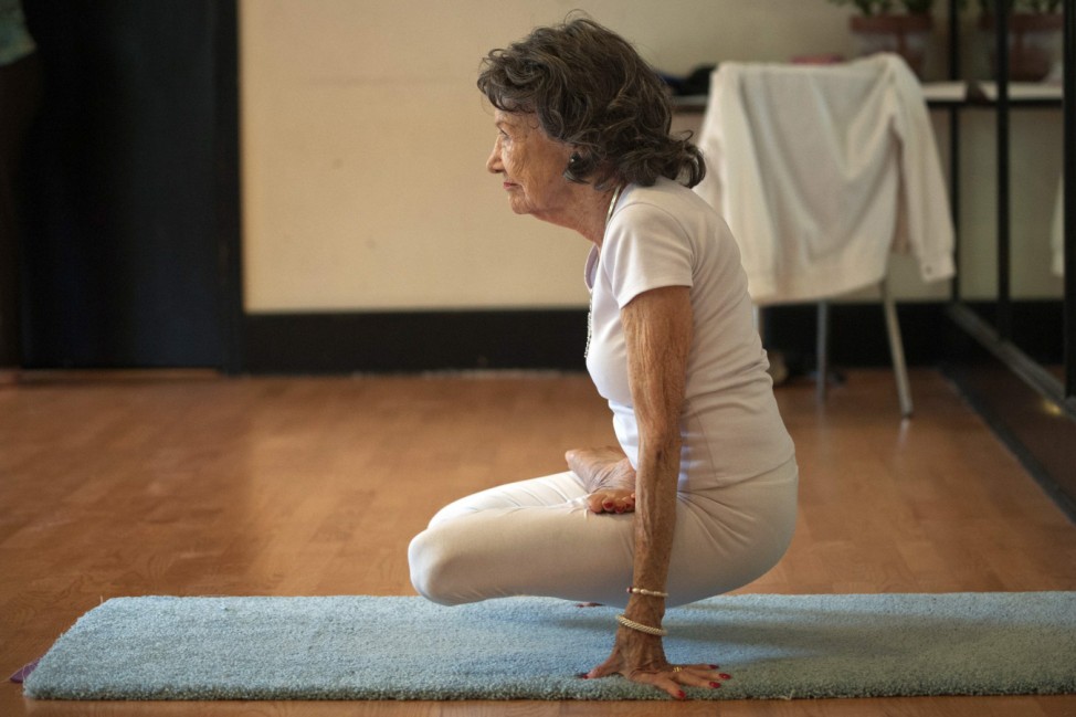 Yoga instructor Tao Porchon-Lynch goes through yoga poses in her yoga class in Hartsdale