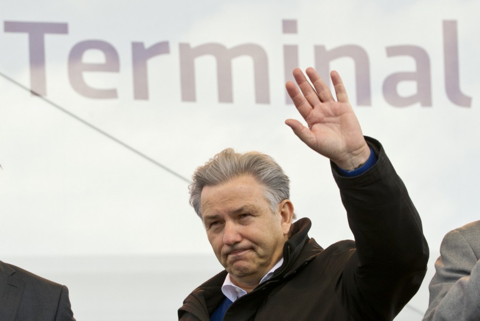 Berlin Mayor Klaus Wowereit waves to the audience during an open house day on the tarmac of the new Berlin Brandenburg airport outside Berlin