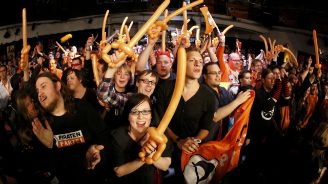 Supporters of the Pirate Party react after the first exit polls for the North Rhine-Westphalia federal state election in Duesseldorf