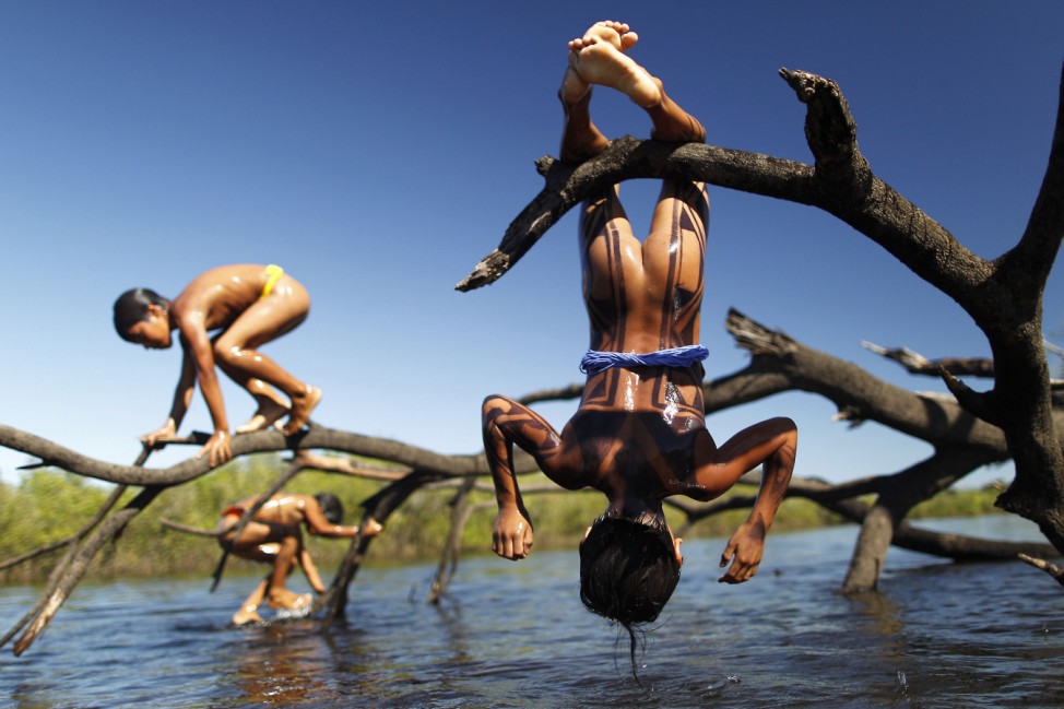 Yawalapiti children play over the Xingu River in the Xingu National Park