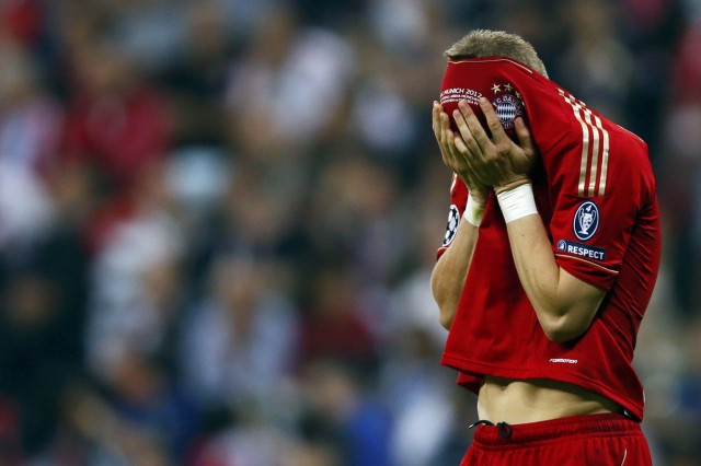 Schweinsteiger of Bayern Munich reacts after missing a penalty against Chelsea during their Champions League final soccer match at the Allianz Arena in Munich