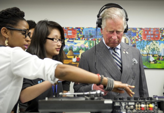 Prince Charles learns how to scratch and fade with a turntable as he tours an employment skills workshop in Toronto