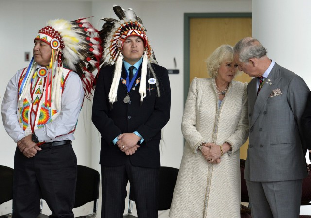 Britain's Prince Charles speaks with Camilla, Duchess of Cornwall during an event at the First Nations University in Regina