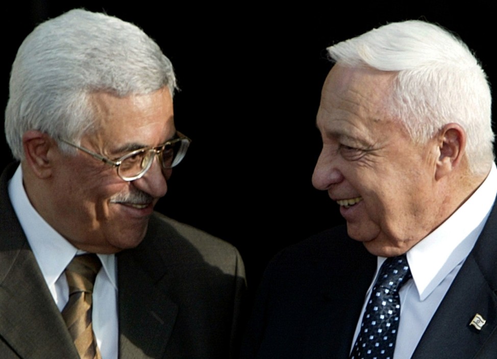 File photo of Palestinian PM Abbas and Israeli PM Sharon meeting for talks in Jerusalem
