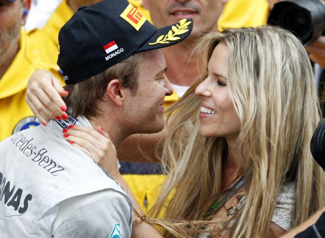 Mercedes Formula One driver Nico Rosberg of Germany celebrates with his girlfriend Vivian Sibold after finishing second in the Monaco F1 Grand Prix