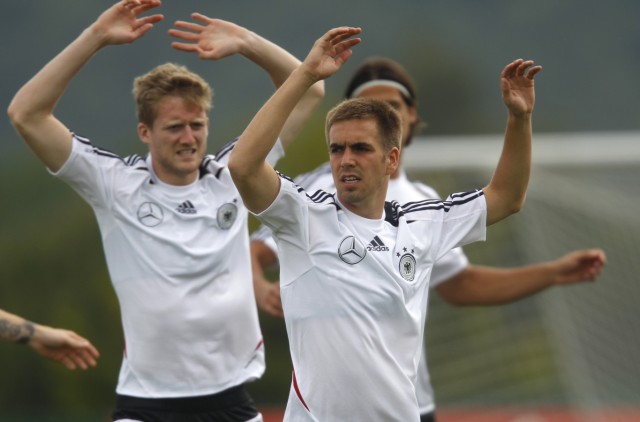 German national soccer players Lahm and Schuerrle warm up during a training session in Tourrettes
