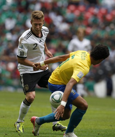 Germany's Mitchell Weiser battles Brazil's Emerson during their match for third place in the U-17 World Cup Mexico 2011 in Mexico City