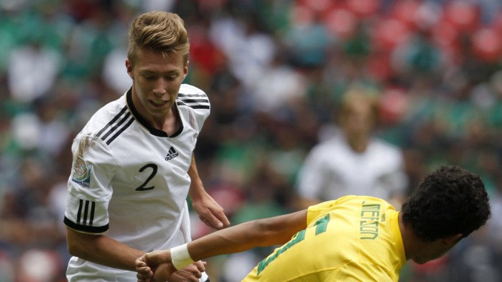 Germany's Mitchell Weiser battles Brazil's Emerson during their match for third place in the U-17 World Cup Mexico 2011 in Mexico City