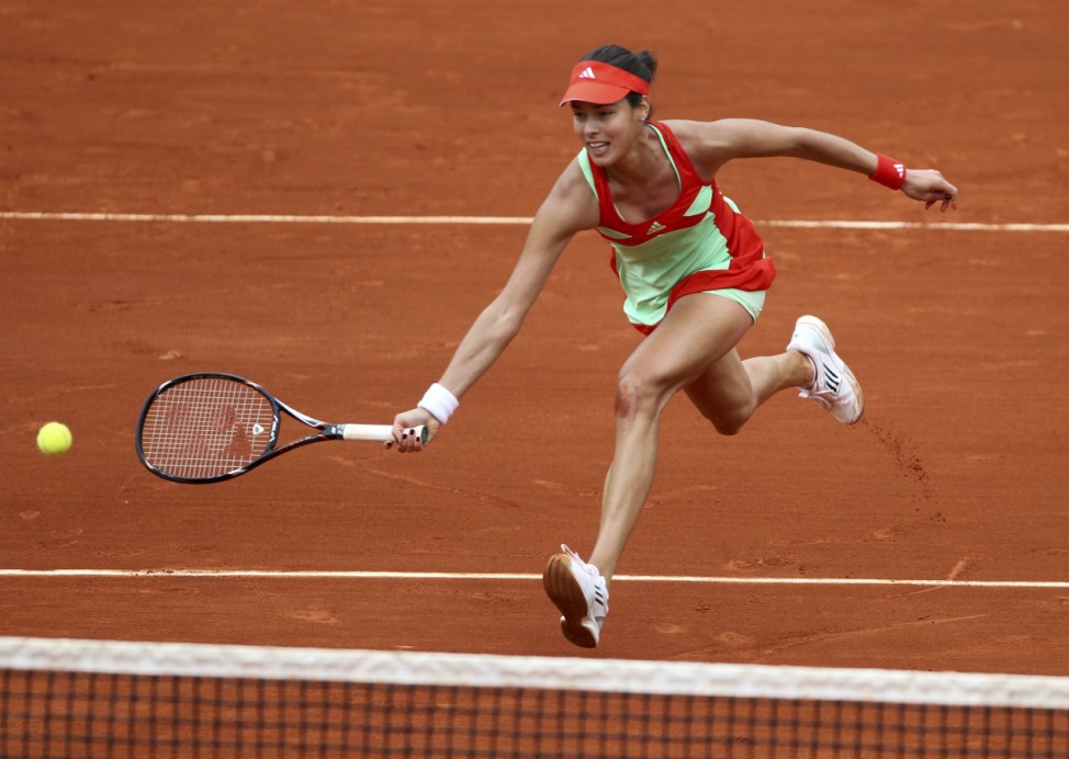 Ivanovic of Serbia returns the ball to Errani of Italy during the French Open tennis tournament at the Roland Garros stadium in Paris