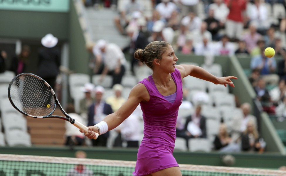 Errani of Italy returns the ball to Ivanovic of Serbia during the French Open tennis tournament at the Roland Garros stadium in Paris