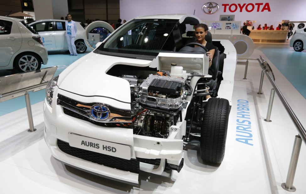 A model poses inside a Toyota Auris Hybrid HSD car during a press preview day at the AMI Auto Show in Leipzig