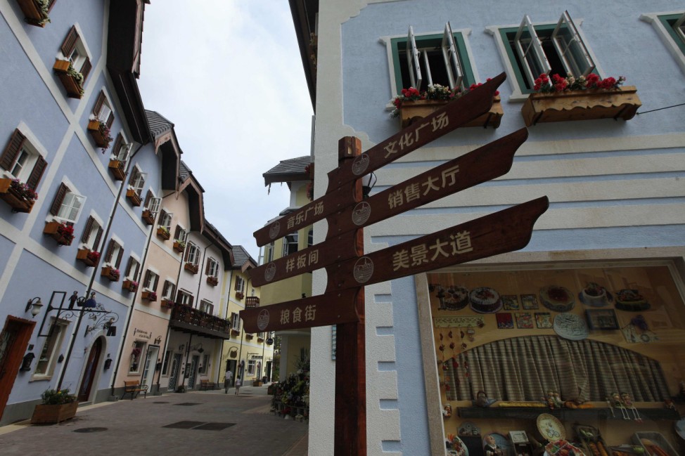 A Chinese road sign is seen at the replica of Austria's UNESCO heritage site, Hallstatt village, in Huizhou