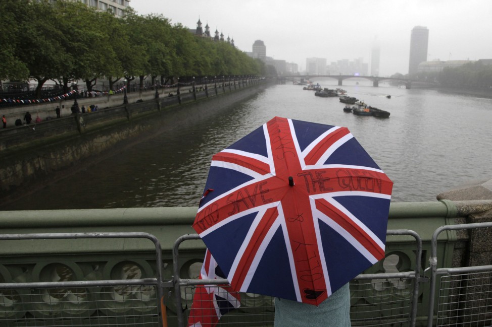 A spectator waits on Westminster Bridge in central London