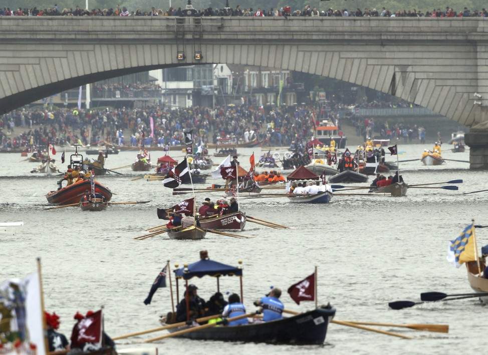 Boats line up for the start of the Diamond Jubilee River Pageant on the Thames river in London