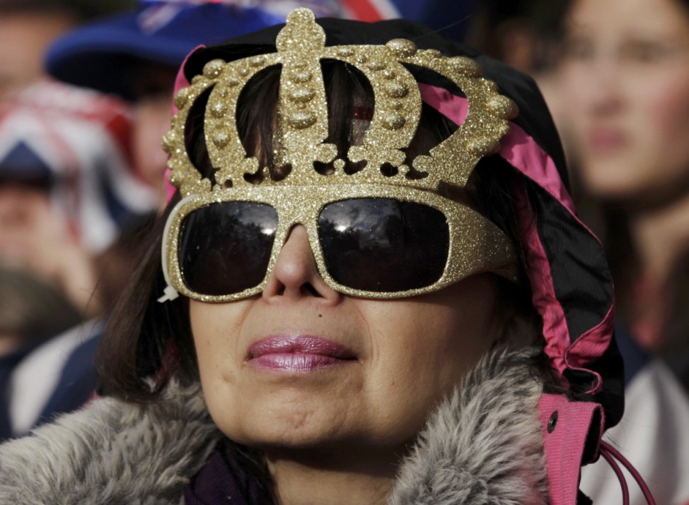 A spectator watches the Diamond Jubilee concert at Buckingham Palace in London