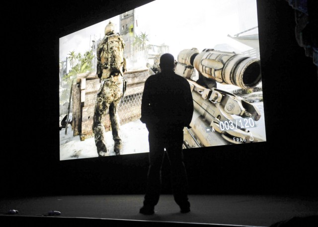 Executive producer of 'Medal of Honor Warfighter' Goodrich looks at a demonstration during the Electronic Arts news conference in Los Angeles