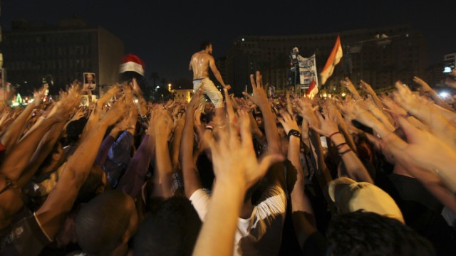 Ultras soccer fans shout slogans against the verdict for deposed leader Mubarak and against presidential candidate Shafiq during a demonstration in Cairo