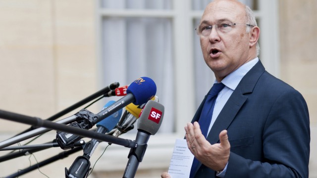 France's Labour, Employment and Social Dialogue Minister Sapin speaks to journalists in Paris