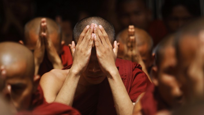 Rakhine Buddhist monks pray for peace at the Sule pagoda in central Yangon