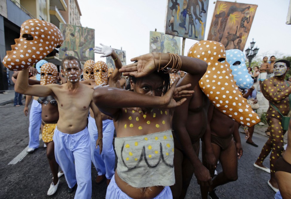 Actors perform during a project organized by Afro-Cuban artist Mendive ahead of the 11th Biennial contemporary art festival in Havana