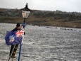 A man hangs a Falklands flag in Stanley, during commemorations for the 30th anniversary of the Falklands War