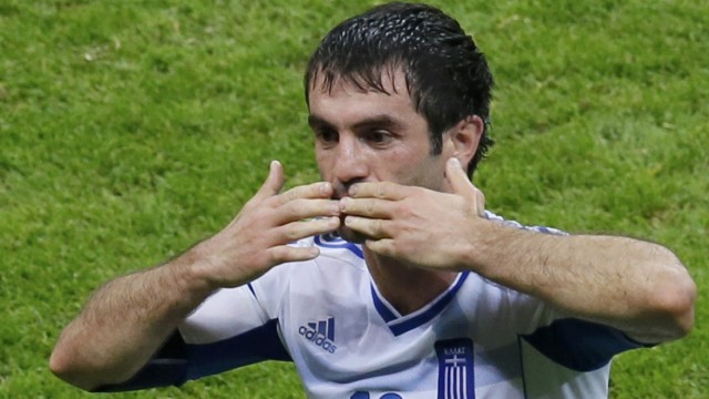 Greece's Karagounis celebrates his goal against Russia during Euro 2012 soccer match in Warsaw