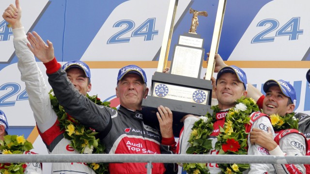 Audi R18 TDI Number 1 drivers Lotterer, Fassler and Treluyer celebrate on podium with Audi motorsport chief Ullrich after winning Le Mans 24-hour sportscar race