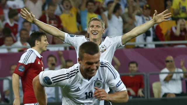 Germany's Schweinsteiger celebrates after his team mate Podolski scored a goal against Denmark during their Group B Euro 2012 soccer match at the New Lviv stadium in Lviv