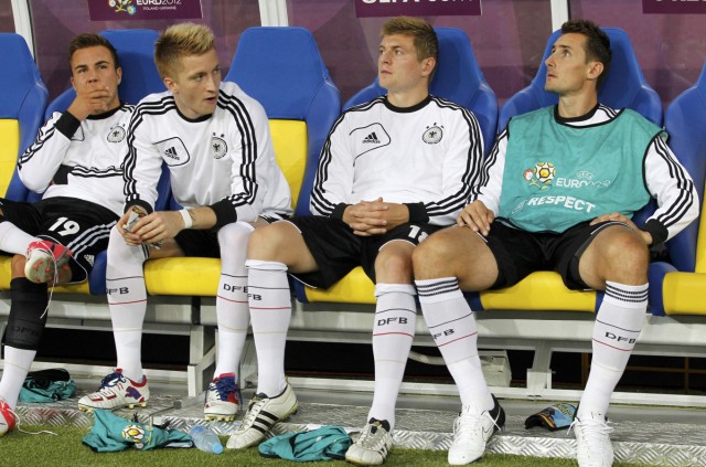 Germany's Klose, Kroos,  Reus  and Goetze  sit on the bench their Group B Euro 2012 soccer match against Denmark at New Lviv stadium in Lviv