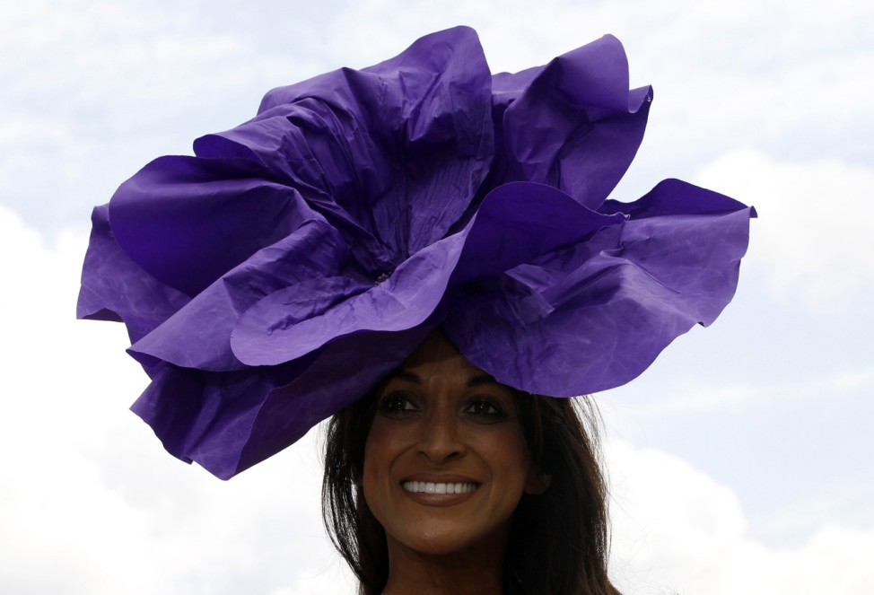 Race goer St Clair poses for photographs on the second day of racing at the Royal Ascot, southwest of London