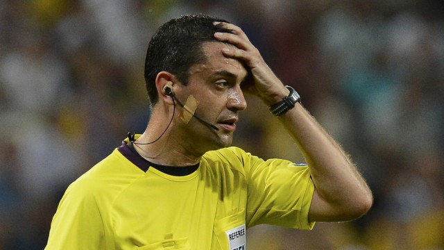 Referee Kassai of Hungary reacts during the Group D Euro 2012 soccer match between Ukraine and England at Donbass Arena in Donetsk