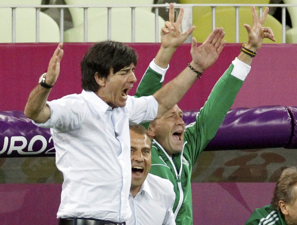 Germany's coach Joachim Loew and team mates celebrate a goal during the Euro 2012 quarter-final soccer match against Greece at the PGE Arena in Gdansk