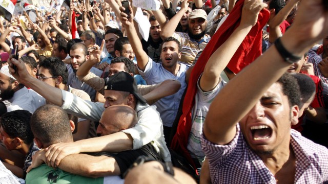 Supporters of Presidential candidate Morsi celebrate victory in T