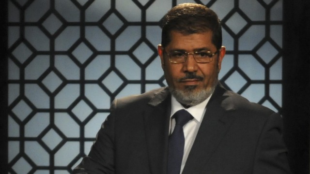 Egypt's President-elect Mohamed Mursi speaks during his first televised address to the nation at the Egyptian Television headquarters in Cairo