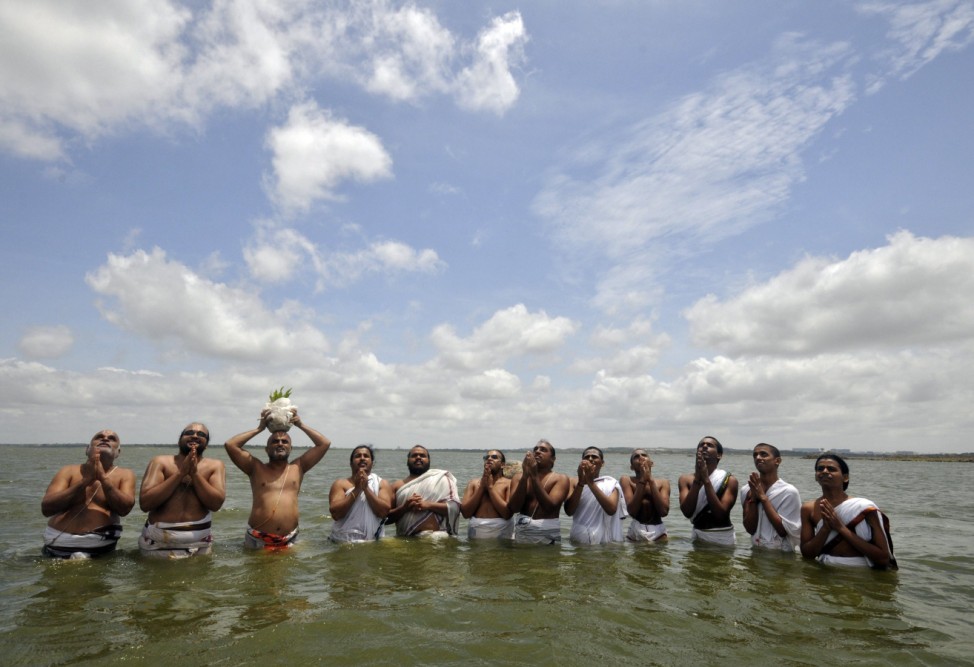 Hindu priests perform Varuna Japam at Osmansagar Lake in Hyderabad
