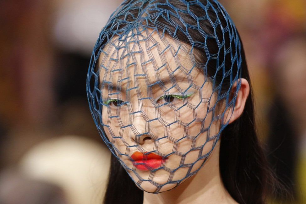A model presents a creation by Belgian designer Raf Simons as part of his Haute Couture Fall-Winter 2012/2013 fashion show for French house Dior in Paris