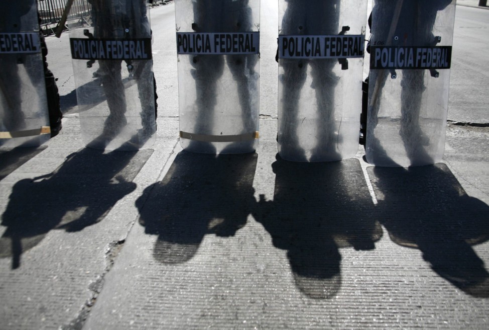 Mexican police stand outside a hotel where Mexico's President Felipe Calderon is holding a meeting in Ciudad Juarez