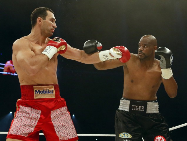 Title holder Klitschko of Ukraine exchanges blows with contender Thompson of the US during their world heavyweight championship title fight at the Stade de Suisse in Bern