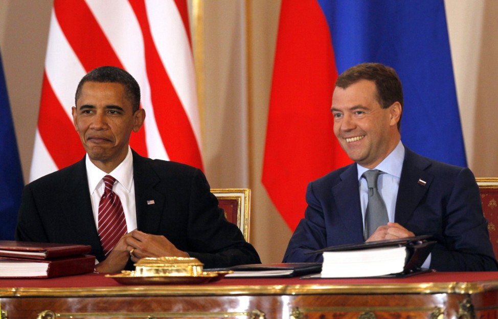 US President Obama and Russian President Medvedev smile as they sign the new Strategic Arms Reduction Treaty at Prague Castle
