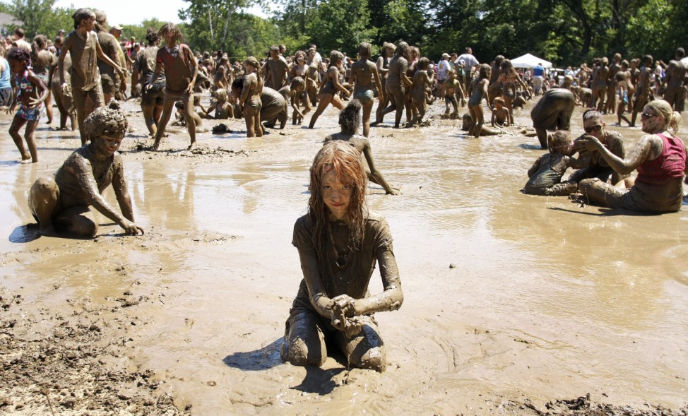 Kids Frolic In The Mud On Michigan Town's 25th Annual 'Mud Day'