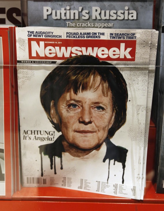 The Newsweek magazine cover showing a portrait of German Chancellor Angela Merkel is seen in a store at the main train station in Berlin