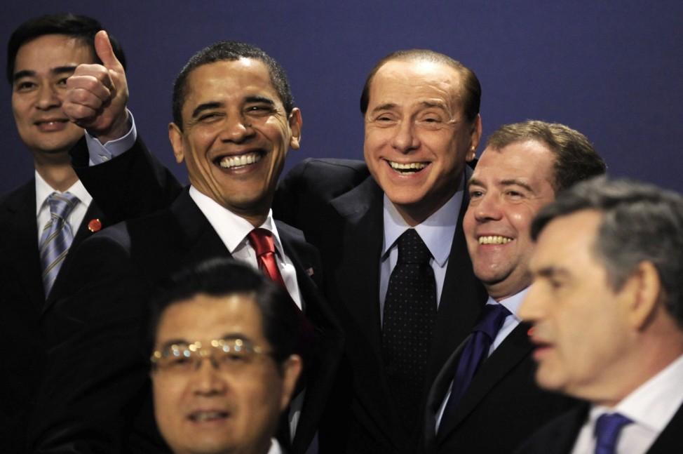 U.S President Obama laughs with Italy's Prime Minister Berlusconi and Russia's President Medvedev as they pose for photograph at the G20 summit in London