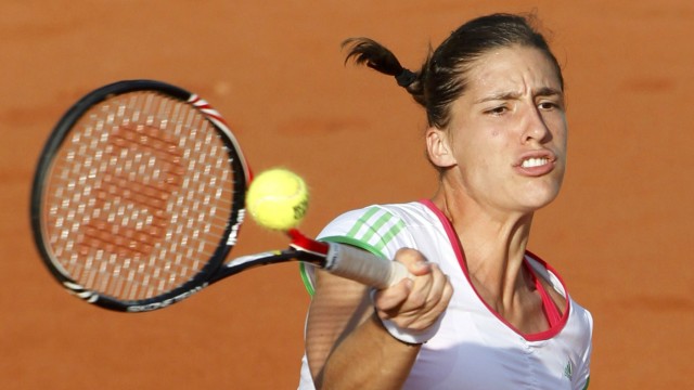 Petkovic of Germany returns the ball to Kirilenko of Russia during  the French Open tennis tournament at the Roland Garros stadium in Paris