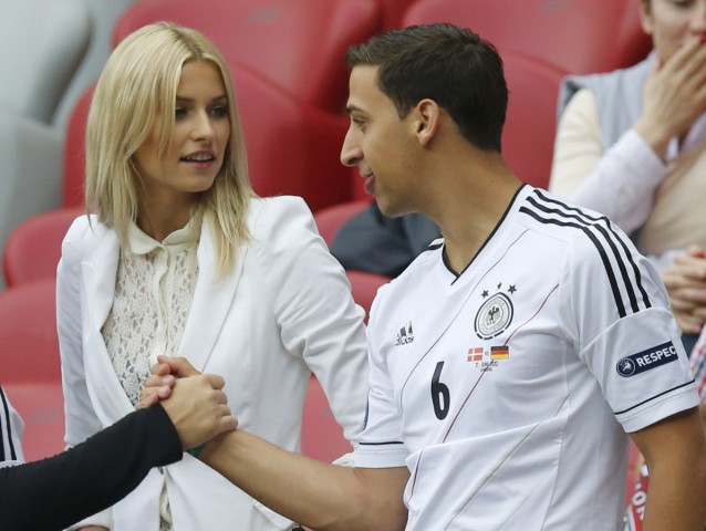 Gercke, girlfriend of Germany's national soccer player Khedira and his brother Rani arrive before the start of the Euro 2012 semi-final soccer match between Italy and Germany in Warsaw